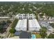 A high-angle view captures a white three-story apartment complex, showcasing the building's design and neighborhood at 5008 S Macdill Ave # 10, Tampa, FL 33611