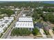A nice aerial view of a white three-story apartment complex surrounded by lush trees and near the waterfront of St. Petersburg, Florida at 5008 S Macdill Ave # 10, Tampa, FL 33611
