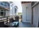Balcony with exterior townhouse view and wicker furniture at 5008 S Macdill Ave # 10, Tampa, FL 33611