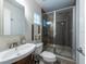 Bathroom showcasing a glass-enclosed shower, modern fixtures, and sleek design elements at 5008 S Macdill Ave # 10, Tampa, FL 33611