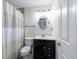 Bright bathroom featuring a vanity, toilet, and shower with a striped curtain at 5008 S Macdill Ave # 10, Tampa, FL 33611