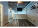 Bedroom view features exposed ceilings and conduit with dark wood laminate flooring at 5008 S Macdill Ave # 10, Tampa, FL 33611