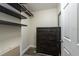 Walk-in closet with dark wood-look shelving and chest of drawers at 5008 S Macdill Ave # 10, Tampa, FL 33611