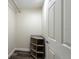 Compact closet with wooden corner shelves and dark wood-look flooring at 5008 S Macdill Ave # 10, Tampa, FL 33611
