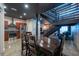 Open-concept dining area featuring a wooden table, staircase, and stainless steel appliances at 5008 S Macdill Ave # 10, Tampa, FL 33611