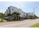 Contemporary apartment complex featuring modern architecture with well-manicured landscaping and palm trees at 5008 S Macdill Ave # 10, Tampa, FL 33611