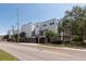 Modern apartment building featuring a clean design with palm trees and well-maintained landscaping at 5008 S Macdill Ave # 10, Tampa, FL 33611
