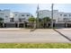 Modern townhouse complex features a row of units with sleek design and well-kept landscaping at 5008 S Macdill Ave # 10, Tampa, FL 33611