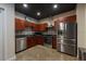 Stylish kitchen with stainless steel appliances, wooden cabinets, and sleek design at 5008 S Macdill Ave # 10, Tampa, FL 33611