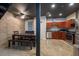 Modern kitchen with stainless steel appliances, wooden cabinets, and a dining area at 5008 S Macdill Ave # 10, Tampa, FL 33611