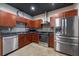 Well-equipped kitchen with modern stainless steel appliances, wooden cabinets, and a functional layout at 5008 S Macdill Ave # 10, Tampa, FL 33611