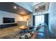 Spacious living room with concrete accent wall, modern decor, and large windows at 5008 S Macdill Ave # 10, Tampa, FL 33611