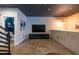 Cozy living room with concrete floors, neutral walls, and a glimpse into the stylish bathroom at 5008 S Macdill Ave # 10, Tampa, FL 33611