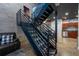 View of an industrial style steel staircase leading to living areas at 5008 S Macdill Ave # 10, Tampa, FL 33611