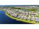 Neighborhood from the air, showing houses surrounding a lake at 5814 Silver Sun Dr, Apollo Beach, FL 33572