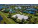 Community with beach volleyball court, pools, tennis courts, clubhouse, and palm trees at 5814 Silver Sun Dr, Apollo Beach, FL 33572