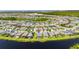 An aerial view of a residential area with houses circling a pond at 5814 Silver Sun Dr, Apollo Beach, FL 33572