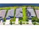 Drone view of a beautiful house with a well-kept lawn close to the lake at 5814 Silver Sun Dr, Apollo Beach, FL 33572