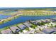 Aerial view of lakefront home with lush landscaping, perfect for serene living at 5814 Silver Sun Dr, Apollo Beach, FL 33572