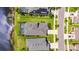 Aerial view showcasing the house layout, landscape, and neighborhood pond at 5814 Silver Sun Dr, Apollo Beach, FL 33572
