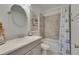 Well-lit bathroom features a vanity, shower, tub, and coastal-themed decorations at 5814 Silver Sun Dr, Apollo Beach, FL 33572