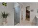 Modern bathroom features tile shower, closet, white countertops, and plank flooring at 5814 Silver Sun Dr, Apollo Beach, FL 33572