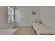 Bedroom with two twin beds, white walls and trim, and double door closet at 5814 Silver Sun Dr, Apollo Beach, FL 33572