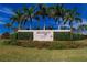 Waterset community entrance sign with lush landscaping, palm trees, and a clear blue sky at 5814 Silver Sun Dr, Apollo Beach, FL 33572
