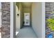 Inviting front entrance featuring a decorative glass door and stone accents at 5814 Silver Sun Dr, Apollo Beach, FL 33572