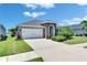 Landscaped single Gathering home with a 2-car garage and covered entry way at 5814 Silver Sun Dr, Apollo Beach, FL 33572