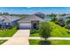 Lovely single-Gathering home with stone details, two-car garage, and a meticulously maintained lawn at 5814 Silver Sun Dr, Apollo Beach, FL 33572