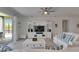 Open living area with a entertainment center and sliding doors that allow natural light to flow in at 5814 Silver Sun Dr, Apollo Beach, FL 33572