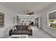 Bright living area with a couch, natural light, water views and built-in shelving at 5814 Silver Sun Dr, Apollo Beach, FL 33572