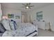 Bedroom with coastal decor features an ensuite bathroom and plush carpeting at 5814 Silver Sun Dr, Apollo Beach, FL 33572