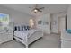 Bright main bedroom with view featuring tasteful coastal decor and white wood furnishings at 5814 Silver Sun Dr, Apollo Beach, FL 33572