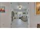 Bright home office featuring white trim, light colored floors, coastal decor, and neutral accents at 5814 Silver Sun Dr, Apollo Beach, FL 33572