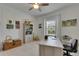 Bright home office with light-colored floors, a ceiling fan, ample storage, and coastal artwork at 5814 Silver Sun Dr, Apollo Beach, FL 33572