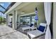 Covered patio with lounge chairs overlooking a beautiful water view at 5814 Silver Sun Dr, Apollo Beach, FL 33572