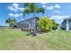 Screened in pool with an outdoor living area and luscious landscaping at 5814 Silver Sun Dr, Apollo Beach, FL 33572