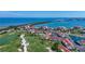Scenic aerial view of the condos and golf course with a bridge and ocean view in the background at 6059 Bahia Del Mar Blvd # 235, St Petersburg, FL 33715