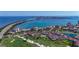 Expansive aerial shot of a community with condos, golf course, waterfront and a bridge to the city at 6059 Bahia Del Mar Blvd # 235, St Petersburg, FL 33715
