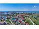 Beautiful aerial view of community featuring red roofs, golf course, and scenic water views at 6059 Bahia Del Mar Blvd # 235, St Petersburg, FL 33715