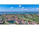 Expansive aerial shot capturing the condo community, lush golf course, and beautiful waterfront at 6059 Bahia Del Mar Blvd # 235, St Petersburg, FL 33715