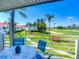 Balcony with seating overlooking a beautiful golf course and tropical landscaping at 6059 Bahia Del Mar Blvd # 235, St Petersburg, FL 33715