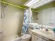 Bathroom featuring a walk-in shower, ample counter space, and neutral tones at 6059 Bahia Del Mar Blvd # 235, St Petersburg, FL 33715