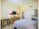 Comfortable bedroom with modern decor, a ceiling fan, and a mirrored closet door, creating a serene atmosphere at 6059 Bahia Del Mar Blvd # 235, St Petersburg, FL 33715