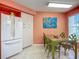Spacious kitchen with dining area and large refrigerator, and view of the outside at 6059 Bahia Del Mar Blvd # 235, St Petersburg, FL 33715