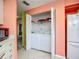 Kitchen includes a laundry with a washer and dryer combo, saving space in the home at 6059 Bahia Del Mar Blvd # 235, St Petersburg, FL 33715