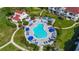 Aerial view of a community pool surrounded by lounge chairs and manicured landscaping at 6059 Bahia Del Mar Blvd # 235, St Petersburg, FL 33715