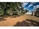 Expansive backyard with a shed, boat dock and canal access, providing serene outdoor living in a quiet neighborhood at 6423 Bass Rd, Weeki Wachee, FL 34607